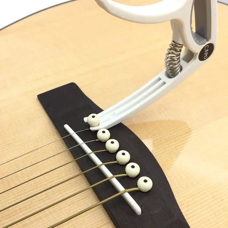 Cejilla de Guitarra de plástic - Musical Instrument Names reseña y precio